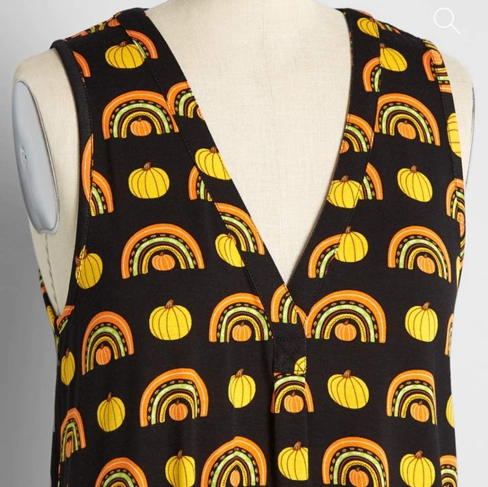 A Welcome Change sleeveless top in black and pumpkin rainbows